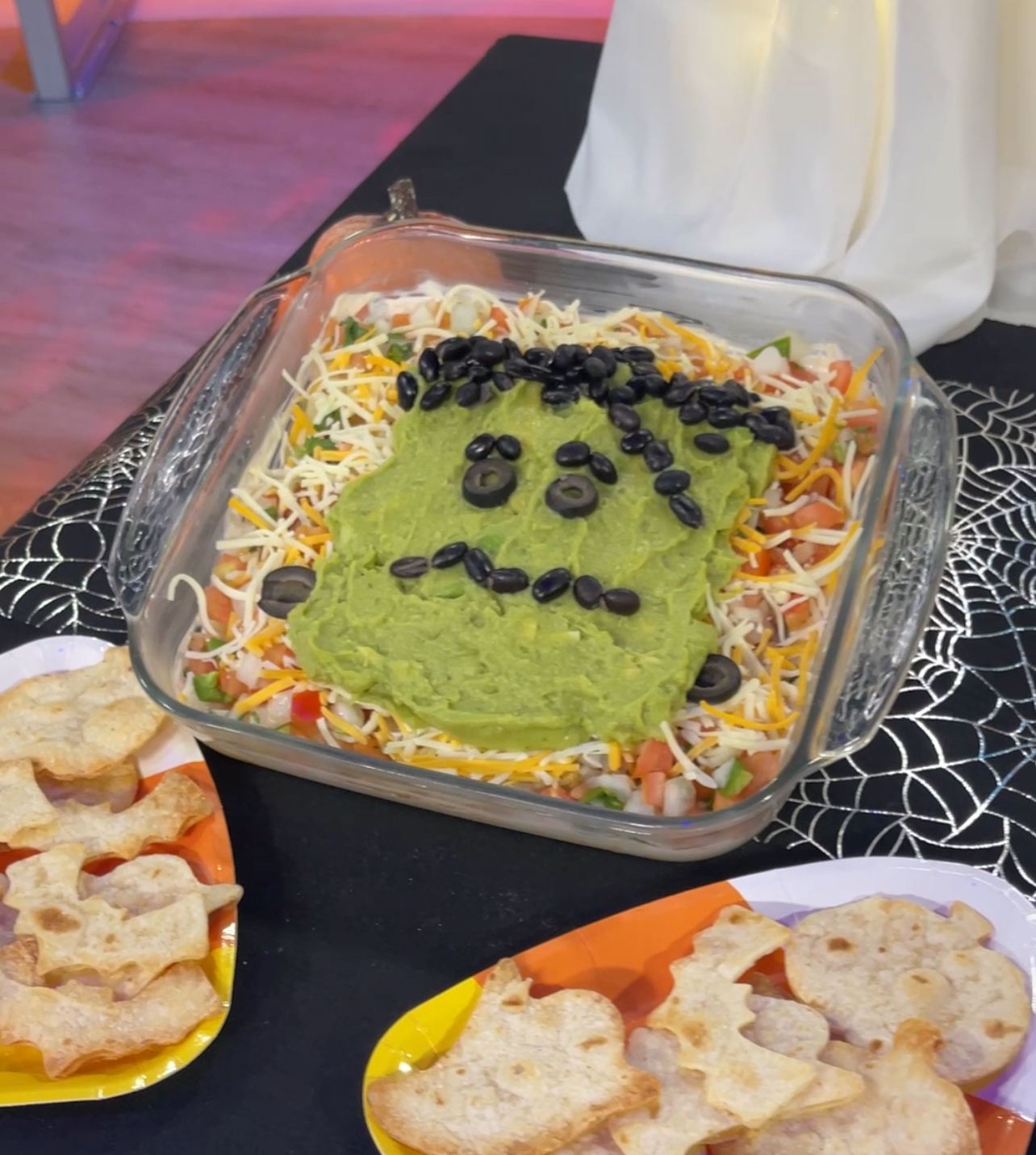 Halloween Party Food Recipe: Frankenstein Layered Taco Dip with Spooky Tortilla Crisps